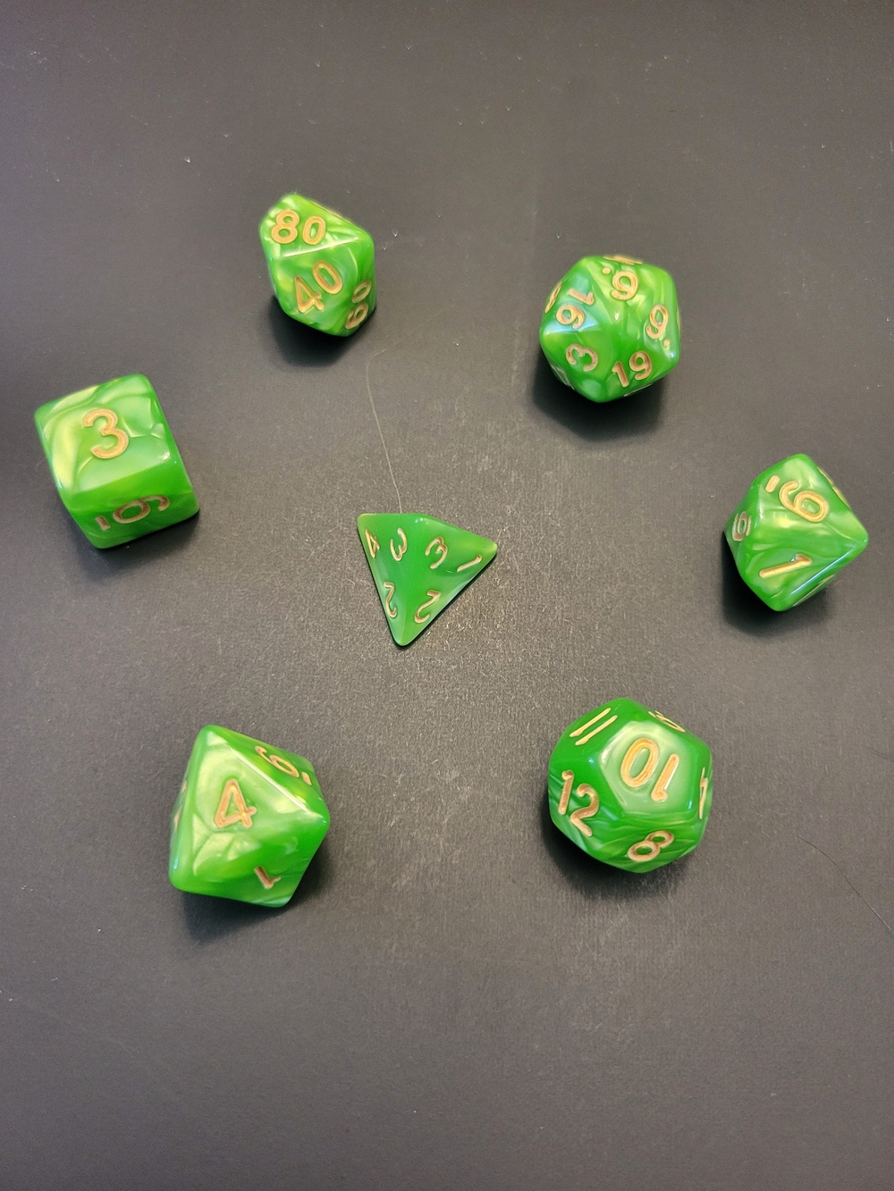Marbled Green RPG Polyhedral Dice Set with Gold Numbers